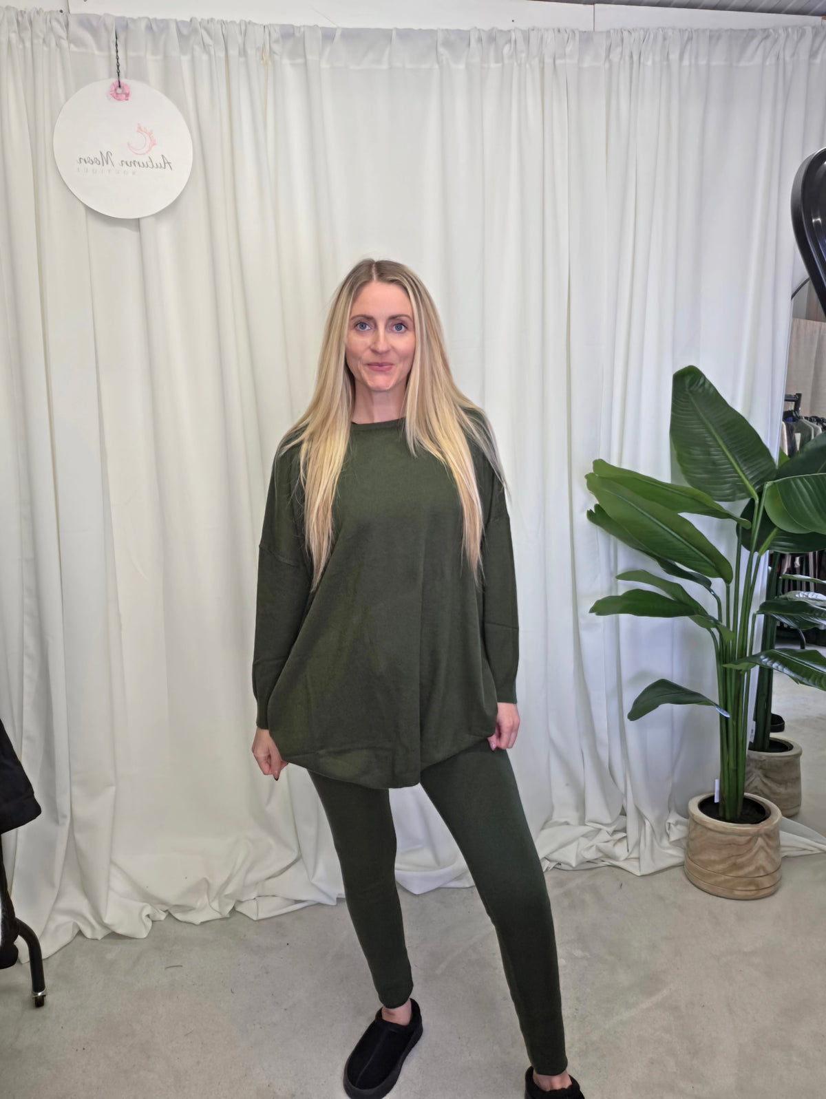 Elara olive green longline top styled with coordinating slim-fit trousers and black shoes