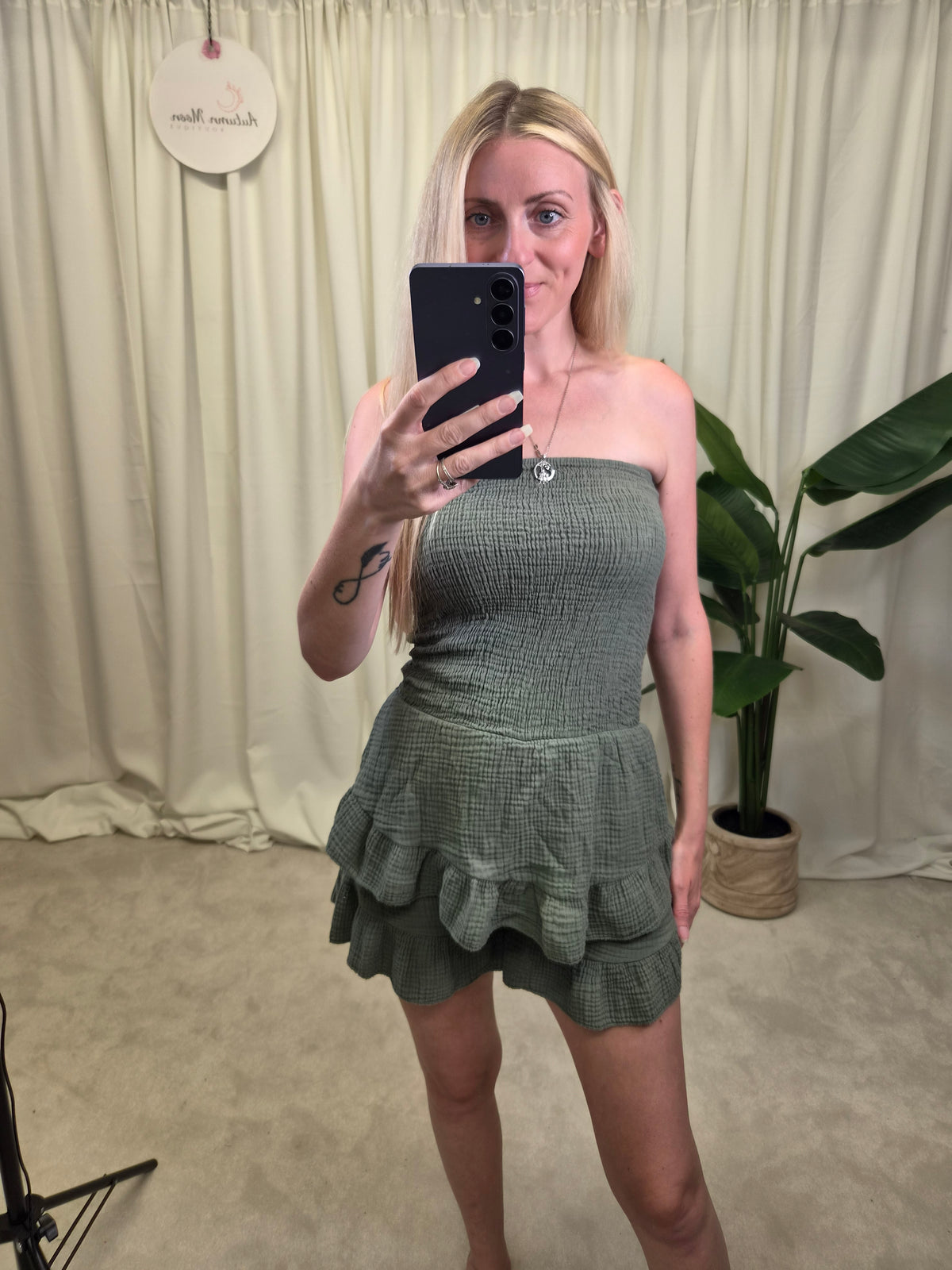 Taurus Sage Smocked Bandeau Mini Dress — sage green strapless smocked bodice with double tiered ruffle mini skirt